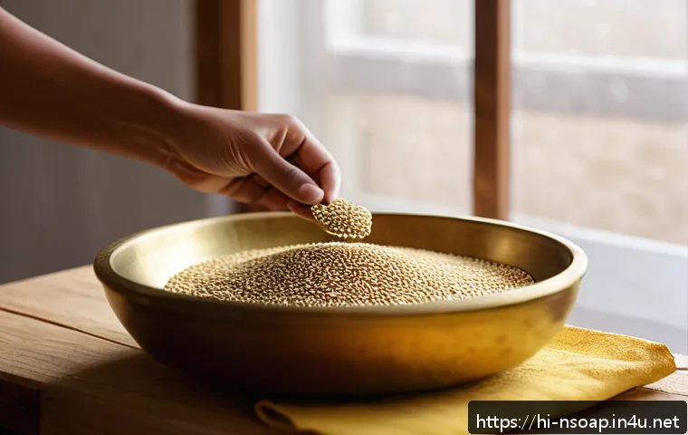 천연비누 오일 추출법 - A bright and clean kitchen setting where a person is manually extracting oil from sesame seeds using...